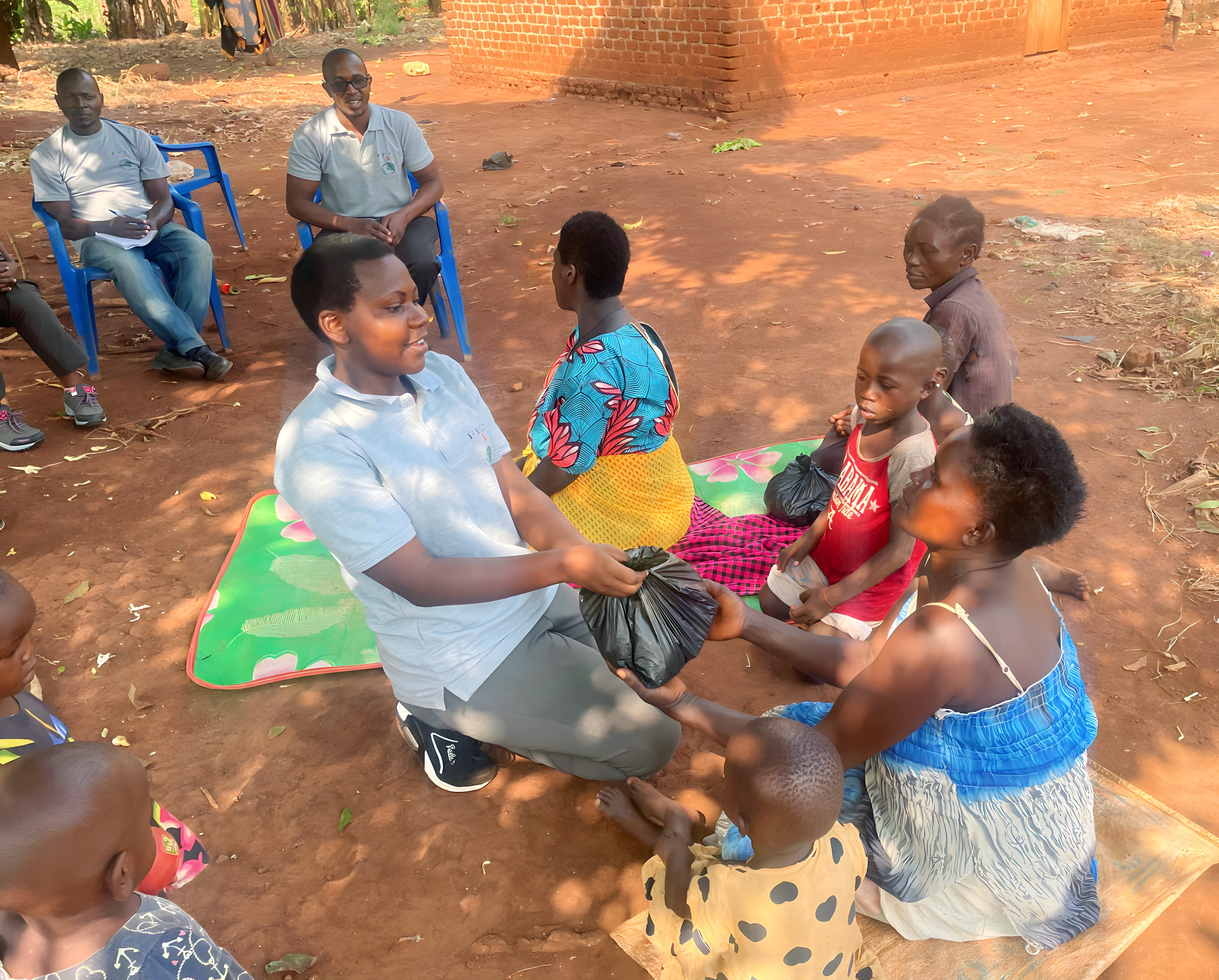 Team member distributing supplies to community